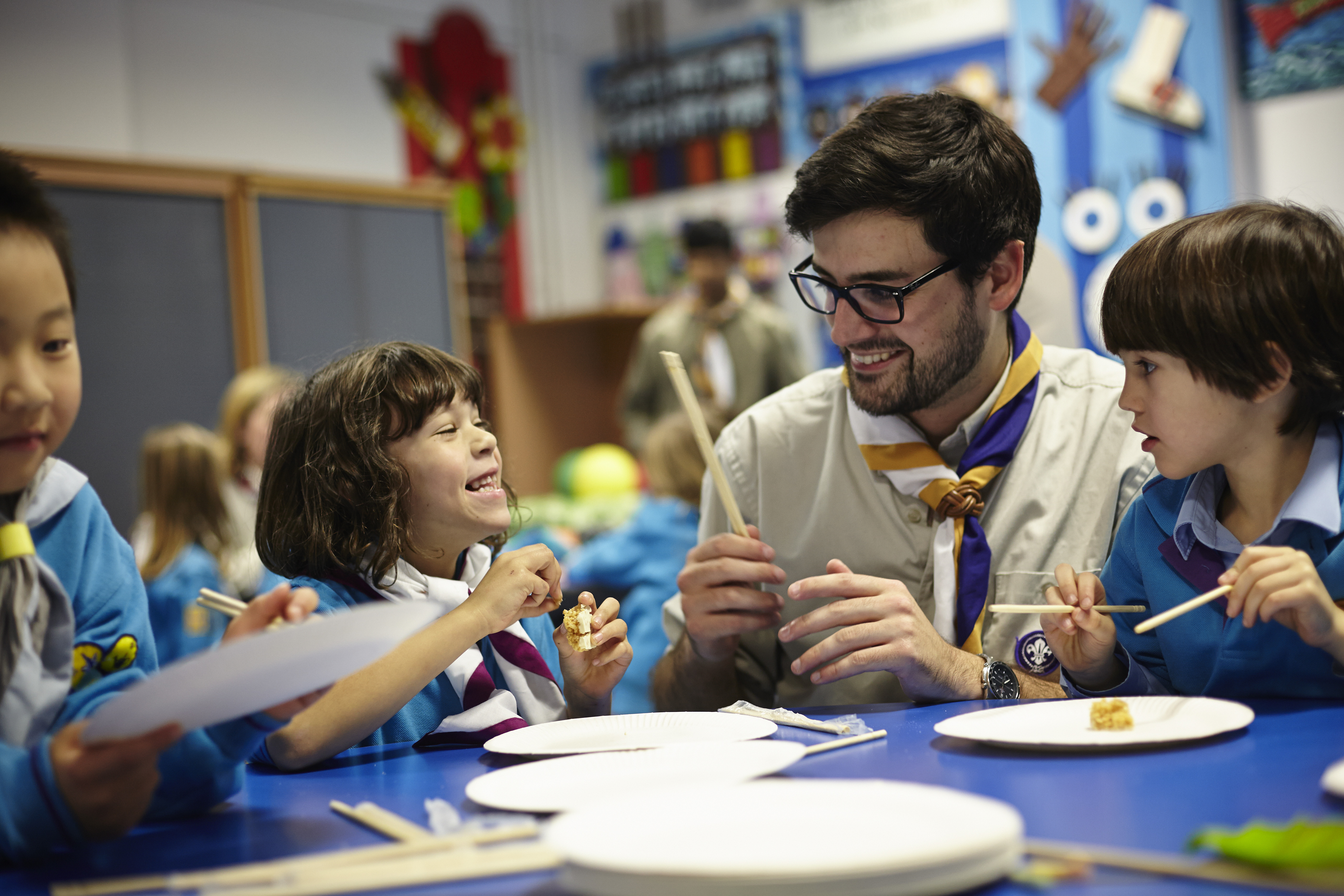A leader working with some Beavers